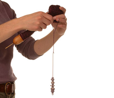 كيفية صنع خيوط الكابلات على مغزل اليد